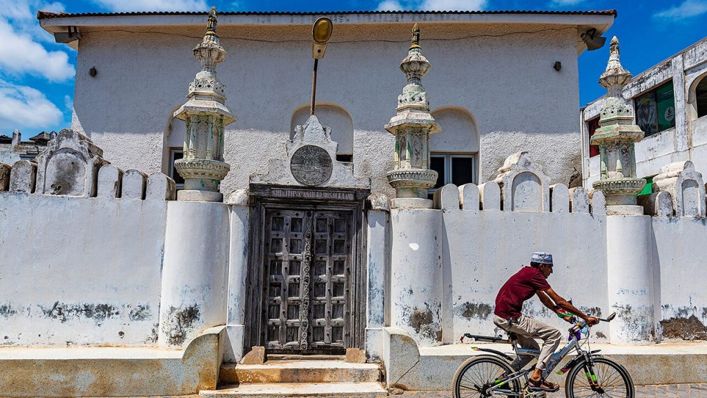 A cyclist in Lanu Town, Kenya