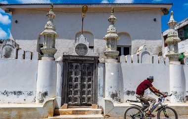 A cyclist in Lanu Town, Kenya